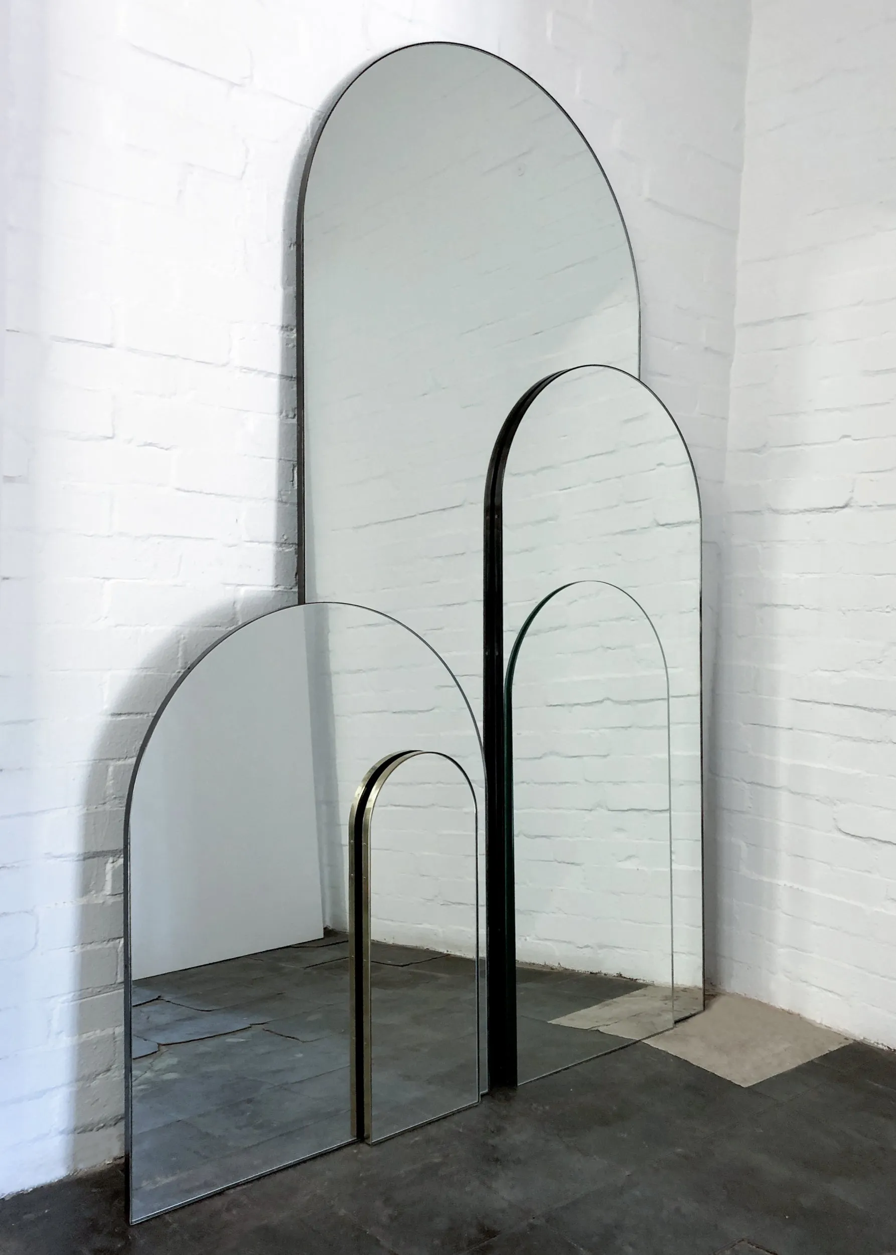 Arcus™ Arch shaped Oversized Wall-leaning Modern Mirror with a Brass Frame